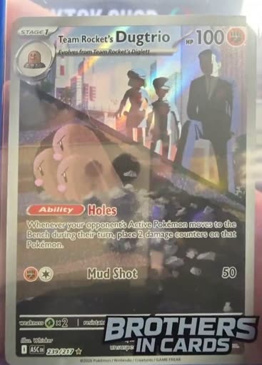 Team Rocket's Dugtrio, Illustration Rare, held up big on screen